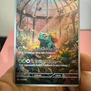 May include: A Bulbasaur trading card featuring a green creature in a glass greenhouse with butterflies and feathers. The card displays 70 HP, Brushstroke Seed 20, and Twilight Bloom 60 attacks, with a metallic finish and detailed botanical artwork.
