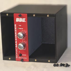 May include: A BBE Sonic Maximizer SM500 audio processor module featuring a red front panel with two silver knobs, labeled Process and Contour, along with Clip and Signal indicator lights and an In/Out button, housed in a black metal frame.