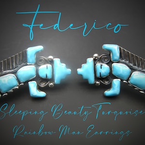 May include: Pair of turquoise and silver earrings in a Rainbow Man design. The earrings feature Sleeping Beauty turquoise stones set in a silver frame. The word "Federico" is written in a teal script above the earrings.