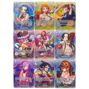 May include: Nine collectible trading cards featuring anime characters. Each card has a unique illustration with character names and numerical values. The cards have a holographic finish with a colourful design.
