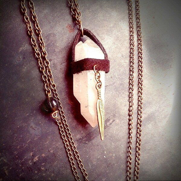 Leather wrapped crystal point necklace with feather