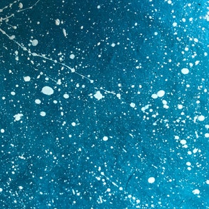 blue cover paper w/ white splatters