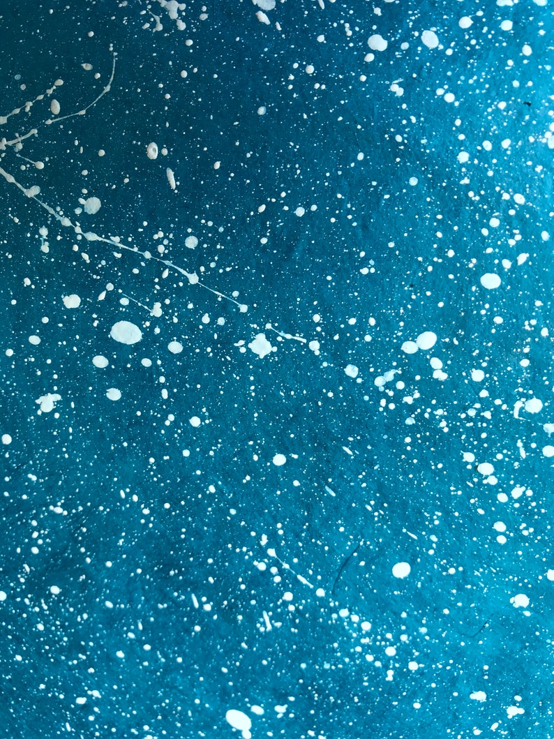 blue cover paper w/ white splatters