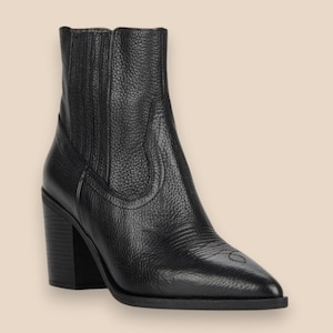 May include: A black ankle boot with a textured leather finish, featuring a pointed toe, a stacked block heel, and elastic side panels. The boot has decorative stitching details on the side and toe area, providing a structured silhouette.