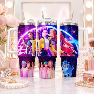 May include: Three stainless steel tumblers with white handles and silver straws. Each tumbler features a vibrant design with anime-style characters in a purple and blue space-themed background. The bottom of each tumbler has a different group of people.