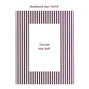 May include: A Deep Burgundy Strip Mat with vertical stripes. The text reads Deep Burgundy Strip Mat, Matboard size: 11x14", and Cut-out size: 6x9". This rectangular matboard features a central rectangular opening for framing artwork or photographs.