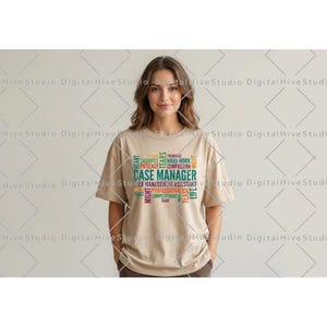 May include: A beige short-sleeved t-shirt featuring a multi-colored word cloud graphic on the chest. The text includes the words CASE MANAGER in large letters, surrounded by smaller words like PATIENCE, HARD WORK, COMPASSION, and LIFE.