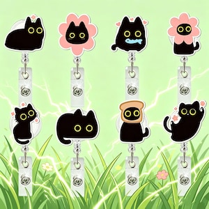 May include: A collection of eight retractable badge holders featuring cartoon black cats with yellow eyes. Some cats are in flower shapes, holding fish, or wearing toast. The badge reels have a clear plastic strap and a metal clip.
