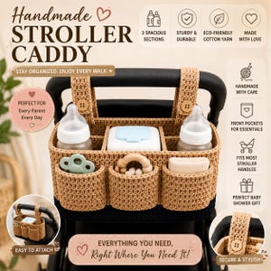 May include: A tan crocheted stroller caddy featuring three main interior compartments and three front pockets. The caddy attaches to stroller handles with two straps secured by wooden buttons. It contains baby bottles and accessories.