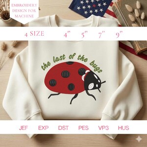 May include: Cream-colored sweatshirt featuring a large embroidered ladybug design with the text "the last of the bugs" in green. The ladybug is red with black spots. The sweatshirt is available in sizes 4", 5", 7", and 9".