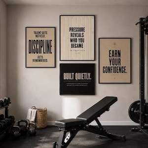 May include: A home gym with motivational posters on the wall. The posters have text that reads: "Talent gets noticed. Discipline gets remembered.", "Pressure reveals who you became in practice.", "Earn your confidence.", and "Built quietly."