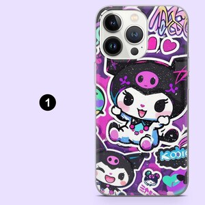 May include: A phone case featuring a colorful cartoon character design. The case has a purple background with graffiti-style art and a smiling character in black and white. The design includes hearts and the word "Kool".