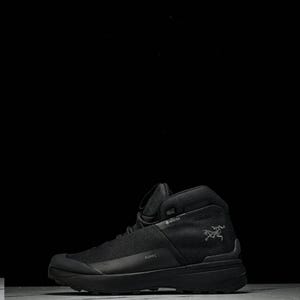 May include: Black mid-top hiking boot with a mesh upper and a thick sole. The boot features the word "KOPIC" on the side and a logo on the side. The boot is designed for outdoor activities.