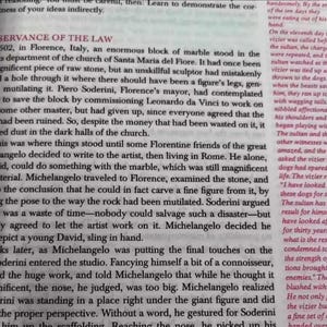 May include: A book page with black text on cream paper, discussing Michelangelo's David statue. The text describes the history of the sculpture and the artist's process.