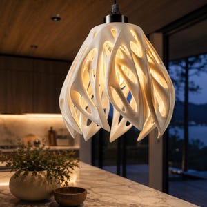 May include: A white pendant light fixture with an intricate, organic, lattice-like structure that resembles a flower or coral. The shade features multiple curved, petal-shaped cutouts that allow light to emit from within, suspended by a black cord.