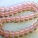 Pale pink Indonesian handmade resin almost round beads 10mm 40 pcs. per strand