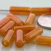 Vintage tiny rust/amber plastic tube bead - about 65 pcs. 5 x 13 mm