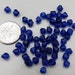 Tiny dark cobalt blue faceted bicone recycled glass bead - 1/2 oz. or about 150 pcs. 5 mm.