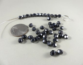 Metallic gunmetal hematite faceted glass beads - 5 x 6 mm. 2 oz. or about 200 pcs.