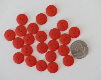 23 coral round 2-holed plastic buttons - 9/16"