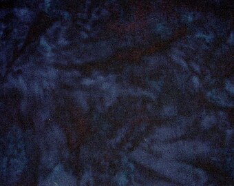 May include: A dark blue fabric with a tie-dye pattern. The fabric has a mottled appearance with shades of blue and black.