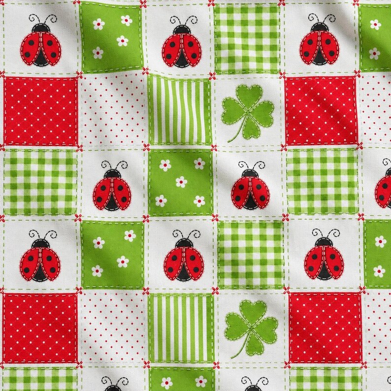 May include: A fabric pattern featuring a grid of alternating squares. The design includes red ladybugs on white, green and white gingham, red with white polka dots, green with white flowers, green stripes, and green four-leaf clovers on white.
