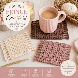 May include: Three handmade crochet coasters with fringe in cream, brown, and mauve. A pink mug with coffee sits on one coaster. The image includes text that reads "BOHO FRINGE Coasters" and "CROCHET PATTERN PDF DOWNLOAD".