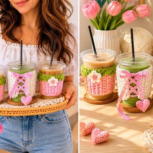 May include: Three clear plastic iced coffee cups featuring handmade crochet sleeves in pink and green with white flower accents. One sleeve includes a white crochet panel with a pink gingham ribbon lace-up detail and a small hanging pink heart.