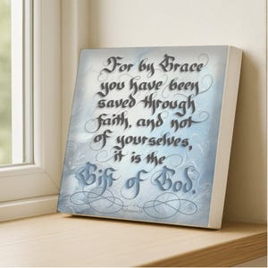 May include: A square canvas wall art piece featuring a light blue and white background with swirling floral patterns. The text reads: For by Grace you have been saved through faith, and not of yourselves, it is the Gift of God.