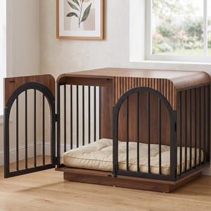 May include: A wooden dog crate featuring a dark walnut finish with a fluted side panel and a black metal arched gate. The structure includes a rectangular base and a soft, tufted cream-colored cushion placed inside for comfort and rest.