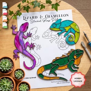 May include: A stained glass pattern sheet titled Lizard & Chameleon Stained Glass Pattern featuring a purple lizard, a blue and green chameleon, and a green and orange iguana, alongside metal tools and small potted succulent plants.