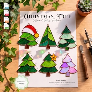 May include: A printed sheet titled Christmas Tree Stained Glass Pattern featuring six illustrated tree designs in various green, yellow, and purple shades. The sheet includes a commercial license badge and text regarding modifications.