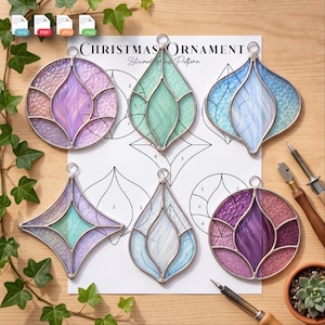 May include: Six stained glass Christmas ornaments in various shapes and colors, including purple, teal, and blue, displayed on a printed pattern sheet labeled Christmas Ornament Stained Glass Pattern with SVG, PDF, JPEG, and PNG file icons.