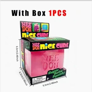 May include: A pink Nee Doh Nice Cube stress ball in a box. The box is black with colorful text and graphics, and the cube measures 6.3 cm on each side. The text on the cube reads "Nee Doh".