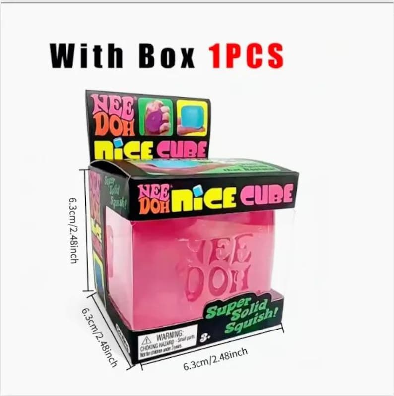 May include: A pink Nee Doh Nice Cube stress ball in a box. The box is black with colorful text and graphics, and the cube measures 6.3 cm on each side. The text on the cube reads "Nee Doh".