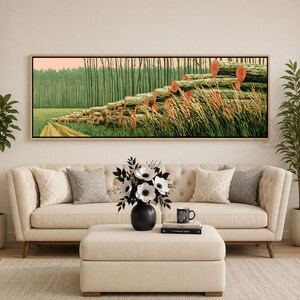 May include: A panoramic landscape painting in a wooden frame featuring a stack of logs arranged in a stepped formation across a grassy field. The logs have visible orange-toned circular ends, and the background shows a dense forest of tall trees.