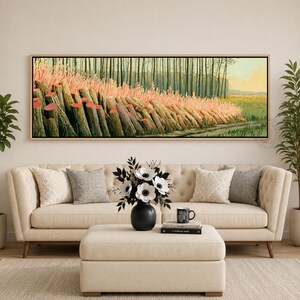 May include: A panoramic landscape painting in a light wood frame featuring a row of textured tree trunks with pinkish foliage and small red circular accents, set against a backdrop of a forest and a grassy field under a soft, pale sky.