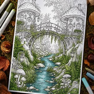 May include: A detailed colouring page illustration featuring two mushroom-shaped houses connected by an arched bridge over a flowing stream. The scene includes lush ferns, rocks, hanging lanterns, and forest foliage rendered in shades of green and blue.