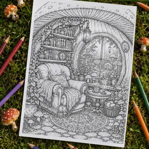 May include: A black and white line art colouring page illustration depicting a cosy interior scene inside a mushroom house. The drawing features an armchair, a small table with a teacup, a bookshelf, and a large circular window looking out.
