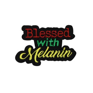 May include: Embroidered patch with the words "Blessed with Melanin" in red, green, and yellow. The patch has a black background and is designed to be ironed or sewn onto fabric. The patch is a statement of pride.