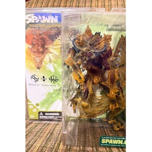 Figura de acción Spawn 2 de la serie 21 de McFarlane Toys: Realidades Alternativas - Alien Spawn
