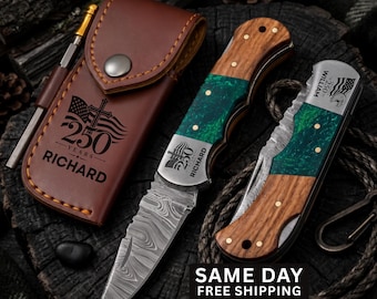 May include: A folding pocket knife with a Damascus steel blade, a handle featuring wood and green resin, and a metal bolster engraved with an American flag, a cross, the text 250 YEARS, and the name RICHARD, alongside a matching brown leather sheath.