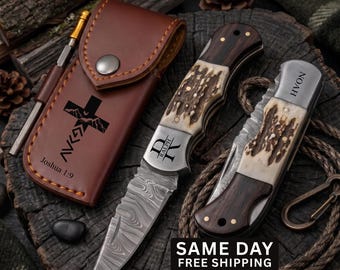 May include: A brown leather sheath with a cross and mountain graphic and the text Joshua 1:9, a Damascus steel folding knife with a stag horn and wood handle engraved with the name Ralph, and a second folding knife with the name Noah engraved.
