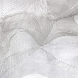 May include: A sheer white fabric with a fine, grid-like mesh texture. The material is draped in soft, flowing folds, creating a layered appearance with varying levels of transparency across the surface of the lightweight, woven textile.
