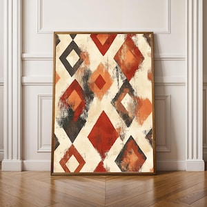 May include: A rectangular framed wall art piece featuring a repeating diamond pattern in shades of deep red, burnt orange, and charcoal grey against a cream-coloured background. The geometric shapes have a distressed, textured paint finish.