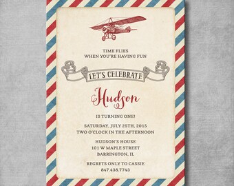 May include: A vintage-style airplane birthday invitation with red, white, and blue stripes. The invitation says "Let's Celebrate Hudson is turning one!" with the date and time of the party.