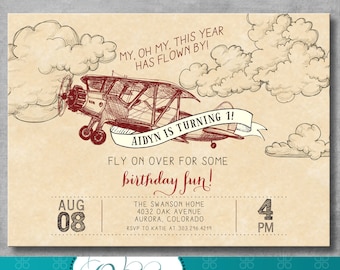May include: A vintage-style invitation for a 1st birthday party with a red airplane illustration and the text "Aidyn is turning 1! Fly on over for some birthday fun!" The invitation includes the date "Aug 08" and time "4 PM" and the address "The Swanson Home 4032 Oak Avenue Aurora, Colorado".