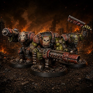 May include: Three green-skinned orc miniatures standing on circular black bases. Each figure wears dark armor with red accents and skull-shaped face masks. They are equipped with heavy weaponry, including a large rotary cannon and a serrated blade.