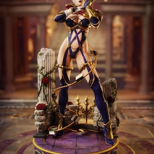 May include: A collectible figurine of a character with short white hair, wearing a dark blue and gold bodysuit with intricate straps. The figure stands on a circular purple base featuring two stone columns adorned with red roses and green vines.
