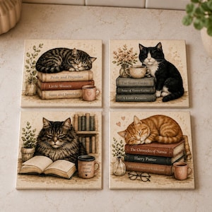 May include: A set of four square coasters featuring illustrations of cats with books. Each coaster displays a different scene with cats, stacks of books titled Pride and Prejudice, Little Women, Sense and Sensibility, The Secret Garden, Anne of Green Gables, A Little Princess, The Chronicles of Narnia, and Harry Potter, along with mugs and plants.